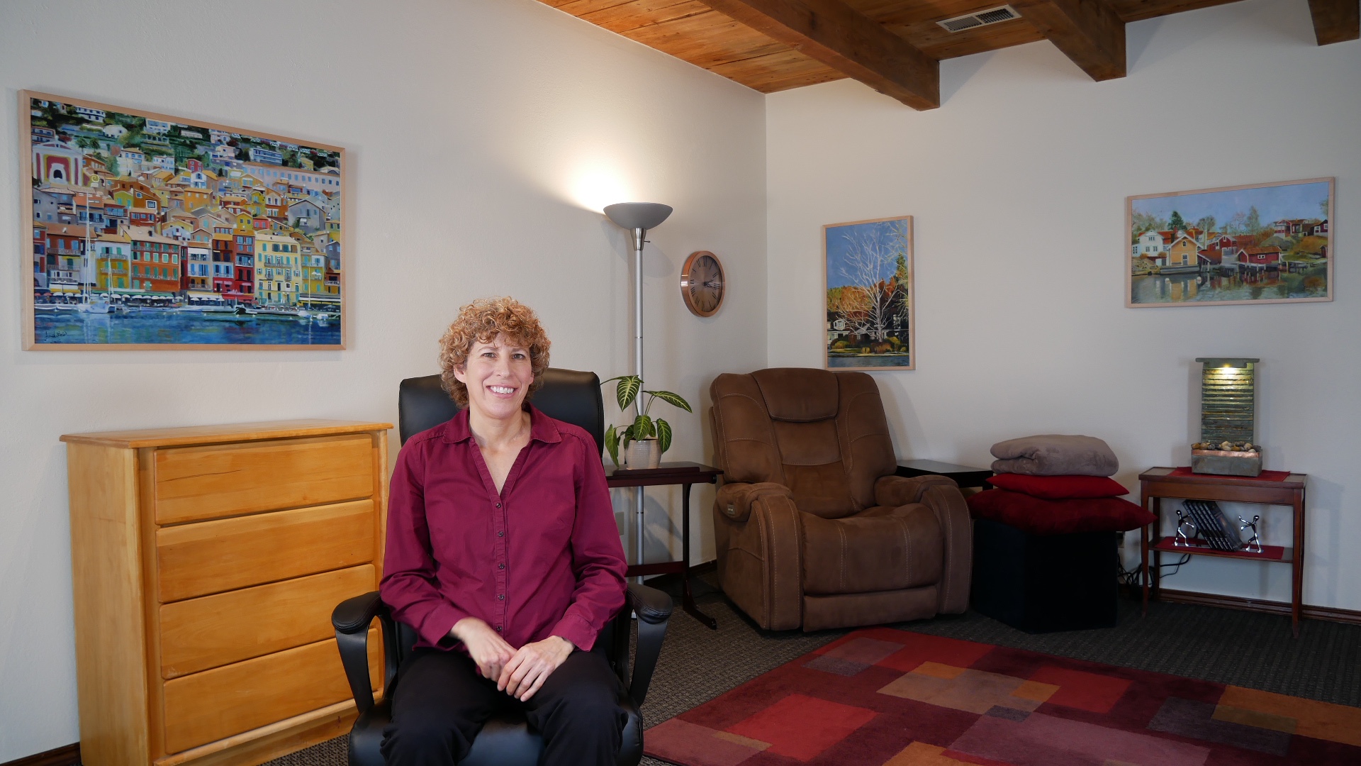 Anat Weinstein seated in her Albuquerque hypnotherapy office